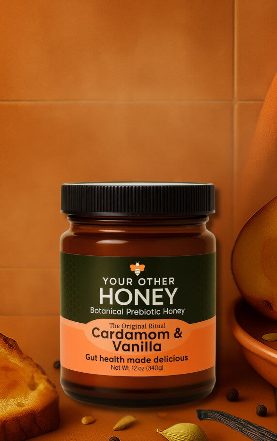 Jar of 'Your Other Honey' Cardamom & Vanilla honey on a warm-toned background